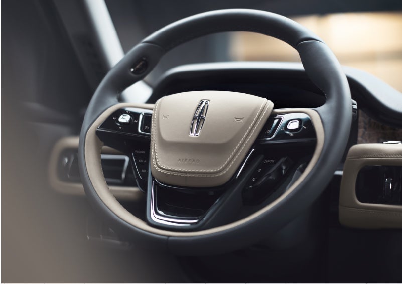 The intuitively placed controls of the steering wheel on a 2023 Lincoln Aviator® SUV | Lincoln of New Bern in New Bern NC