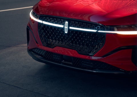 The available front LED light bar and center Lincoln Star logo glow at dusk. | Lincoln of New Bern in New Bern NC