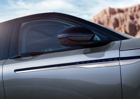 Blue lettering on the side of the vehicle that reads nautilus indicates the available hybrid powertrain. | Lincoln of New Bern in New Bern NC