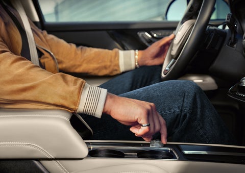 The driver of a 2026 Lincoln Corsair® SUV is shown selecting a drive mode. | Lincoln of New Bern in New Bern NC