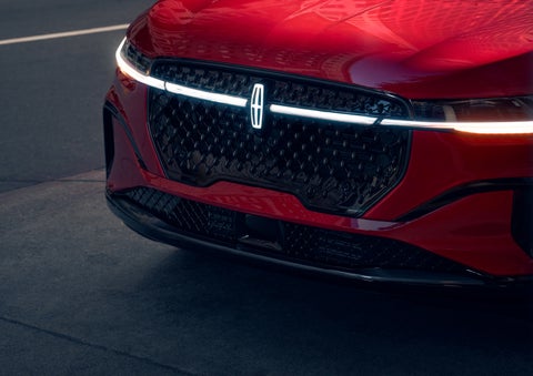 The available front LED light bar and center Lincoln Star logo glow at dusk. | Lincoln of New Bern in New Bern NC