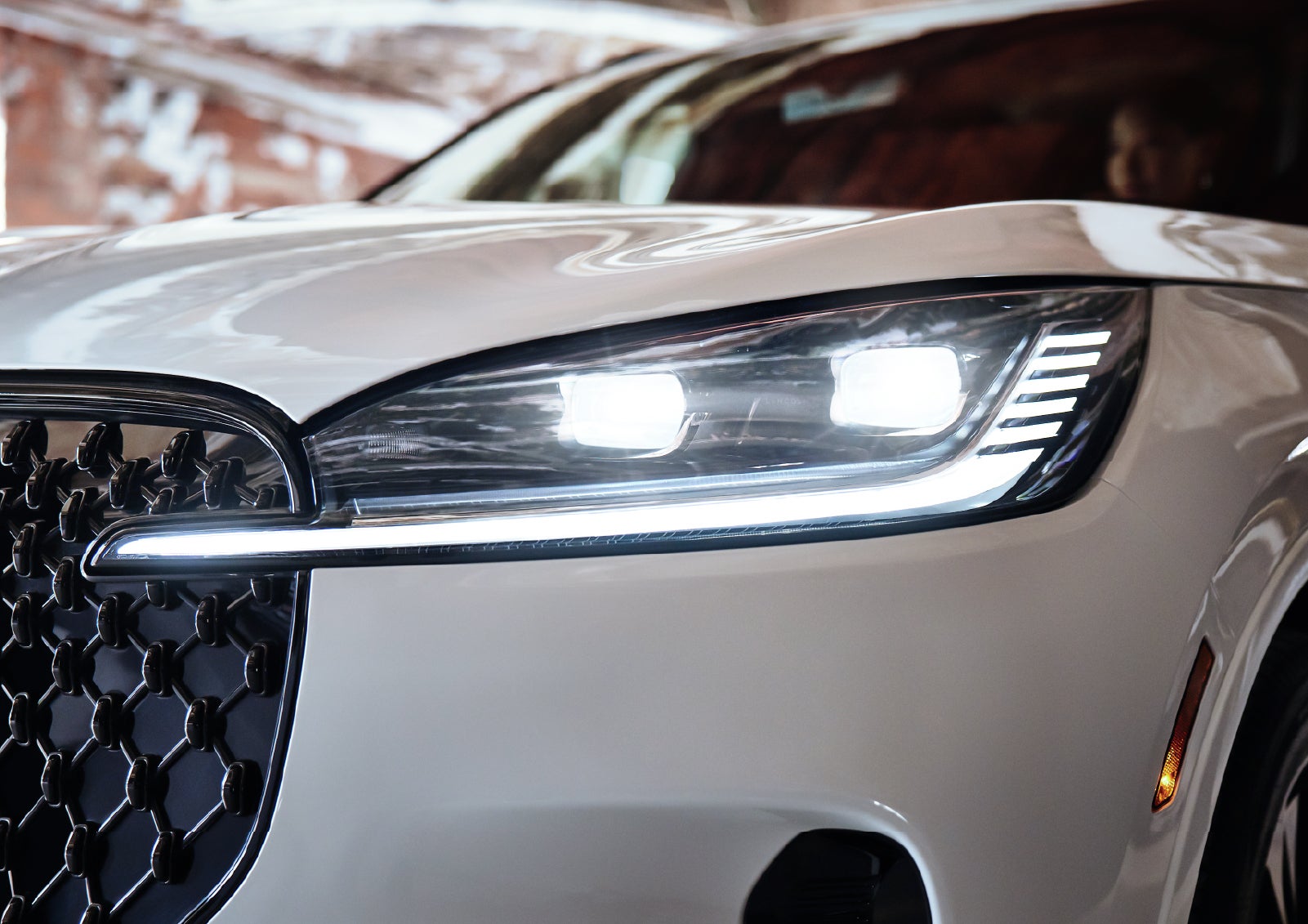 A close-up of a headlamp on the 2027 Lincoln Aviator® SUV is shown. | Lincoln of New Bern in New Bern NC
