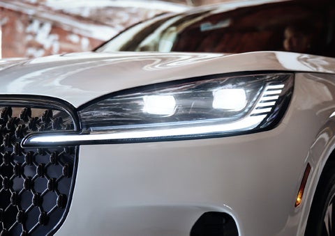 A close-up of a headlamp on the 2027 Lincoln Aviator® SUV is shown. | Lincoln of New Bern in New Bern NC