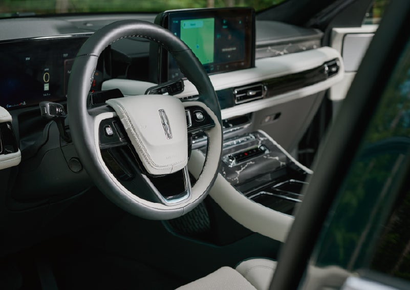 The leather-trimmed steering wheel of a 2027 Lincoln Aviator® Black Label™ SUV. | Lincoln of New Bern in New Bern NC