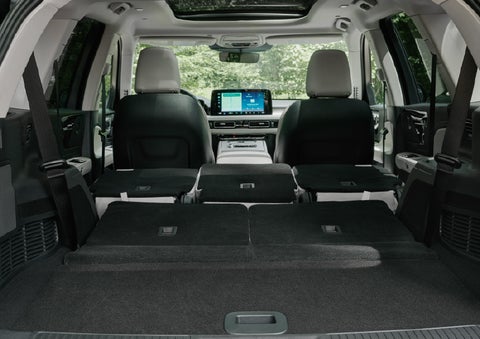 A rear to front view of the interior of a 2027 Lincoln Aviator® Black Label™ SUV shows the third and second rows folded flat | Lincoln of New Bern in New Bern NC